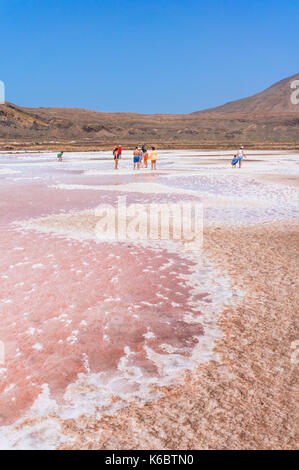 CAPE VERDE SAL Tourists walking around the salt evaporation beds or  Disused Salt pans  Pedra De Lume, Pedra di Lumi, Sal island, Cape Verde, Africa Stock Photo