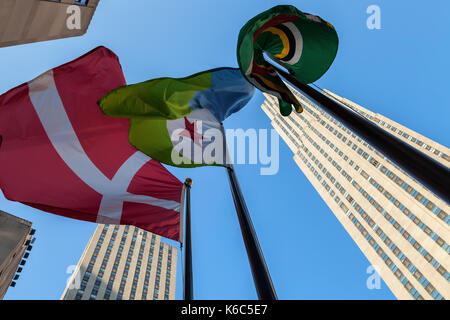 The flag of Denmark and Djibouti fly at the Rockefeller Center in New York City, New York. Stock Photo