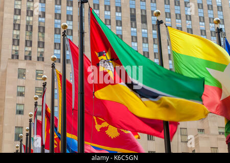 Colorful flags of the world nations fly at the Rockefeller Center in New York City, New York. Stock Photo