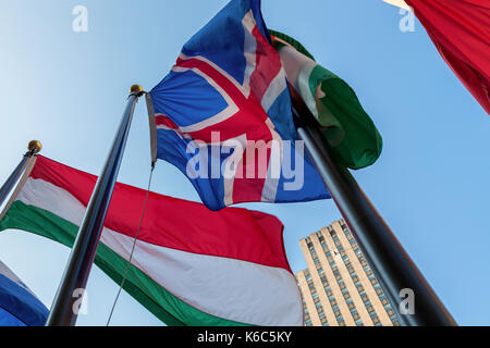 The flags of Hungary and Iceland fly at The Rockefeller Center in New York City, New York. Stock Photo