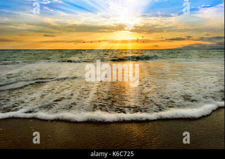 Soul ocen light baptism sunset is an ocean scenci sunset with a bathing solul light of rays coming down from the heavens like a baptism. Stock Photo
