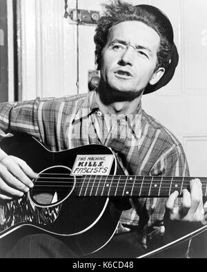 WOODY GUTHRIE (1912-1967) American folk musician in 1943 Stock Photo