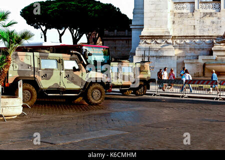 Italian Army, to prevent terrorism attack, patrol the traffic barrier entrance to Via dei Fori Imperiali from Venice Square Square. Rome, Italy, EU. Stock Photo