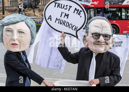 London, UK. 12th Sep, 2017. Masked protesters wait outside Parliament for the announcement of the referral to the Competition authorities of the 21st Century Fox bid for Sky Credit: Ian Davidson/Alamy Live News Stock Photo