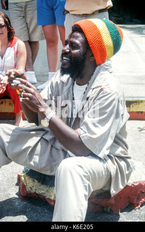 Rastafarian tour guide at Nine Mile, telling the group about Bob Marley. Jamaica Stock Photo