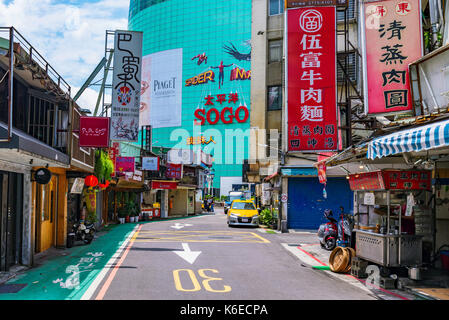 TAIPEI, TAIWAN - JUNE 27: This is a side street in with traditional Taiwanese restaurants and local shops in the Zhongxiao fuxing shopping area on Jun Stock Photo