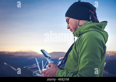 Man operating a drone Stock Photo