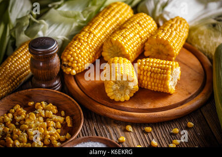 Sweet boiled corn on wooden board Stock Photo