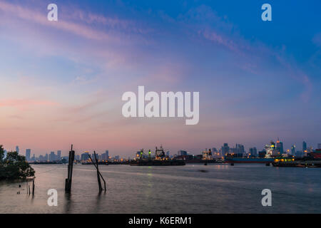 The cargo ships carrying goods between shipping port in Thailand Stock Photo