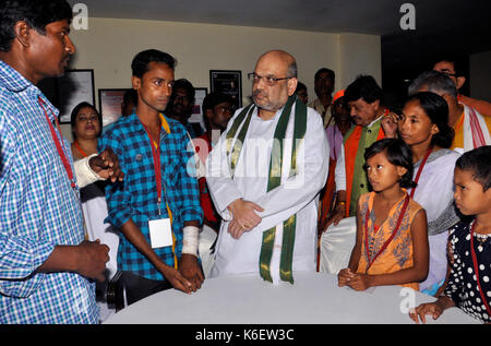 Kolkata, India. 12th Aug, 2017. Bharatiya Janta Party National President Amit Shah (in middle) interacts with the party members and their families who have been affected by the alleged political violence in state on September 12, 2017 in Kolkata. Credit: Saikat Paul/Pacific Press/Alamy Live News Stock Photo