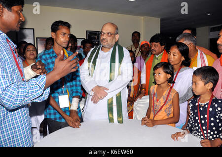 Kolkata, India. 12th Aug, 2017. Bharatiya Janta Party National President Amit Shah (in middle) interacts with the party members and their families who have been affected by the alleged political violence in state on September 12, 2017 in Kolkata. Credit: Saikat Paul/Pacific Press/Alamy Live News Stock Photo