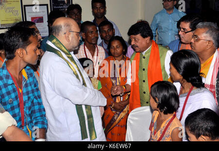 Kolkata, India. 12th Aug, 2017. Bharatiya Janta Party National President Amit Shah(second left) interacts with the party members and their families who have been affected by the alleged political violence in state on September 12, 2017 in Kolkata. Credit: Saikat Paul/Pacific Press/Alamy Live News Stock Photo