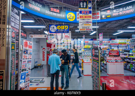 TOKYO, JAPAN JUNE 28 - 2017: Unidentified people in the enter of Yodobashi Camera department store. Yodobashi Camera is a chain store mainly selling electronic products with 21 stores in Japan Stock Photo