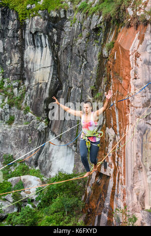 Young woman balancing on slackline, Dibs Quarry, Maripora, Sao Paulo State, Brazil Stock Photo