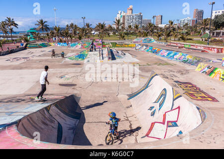 Beach Skateboard Park Durban, South-Africa - 20 Aug 2017: Durban beach front promenade skateboard park ocean  cycling people lifestyle landscape. Stock Photo