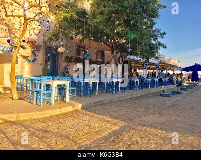 CUNDA ISLAND, TURKEY - MAY 21, 2017: An open air cafe of touristic town Cunda Alibey Island, Ayvalik. It is a small island in the northwestern Aegean Stock Photo