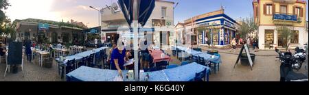 CUNDA ISLAND, TURKEY - MAY 21, 2017: An open air cafe of touristic town Cunda Alibey Island, Ayvalik. It is a small island in the northwestern Aegean Stock Photo