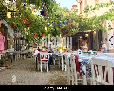 CUNDA ISLAND, TURKEY - MAY 21, 2017: An open air cafe of touristic town Cunda Alibey Island, Ayvalik. It is a small island in the northwestern Aegean Stock Photo