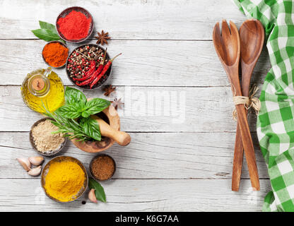 Various spices and herbs on wooden table. Top view with space for your text Stock Photo