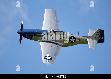 North American P-51 Mustang Miss Helen Second World War fighter plane flying at the Goodwood Revival 2017 Stock Photo