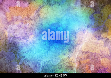 Stone texture with paint effect appearing as powdered paints in multiple hues. Stock Photo