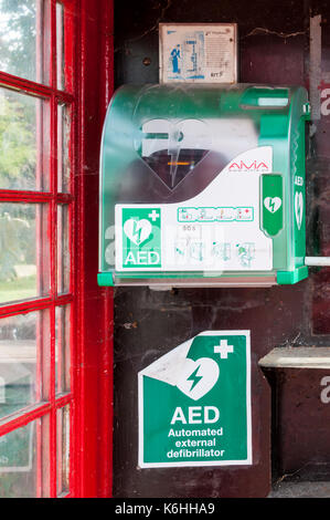 Public defibrillator in old telephone kiosk Stock Photo