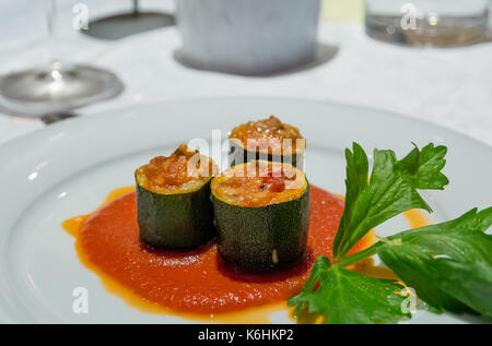 Rolls of courgettes stuffed whit meat and tomato. Selective focus Stock Photo