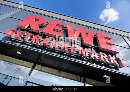 Sign at REWE beverage store. REWE is a large supermarket chain in Germany and part of the Cologne-based REWE Group. Stock Photo