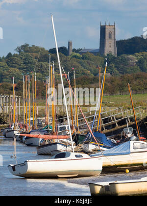 Morston Quay and Blakeney village and Church in the background North Norfolk Stock Photo