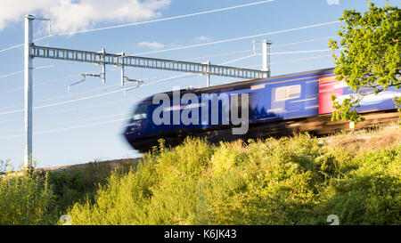 Reading, England, UK - August 29, 2016: A First Great Western Intercity 125 express train at Goring in Berkshire, under new electrification equipment  Stock Photo