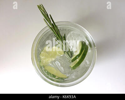 Classic Gin and Tonic cocktail with lime, lemon & rosemary Stock Photo
