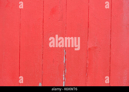 Red paint peeling from wood background Stock Photo