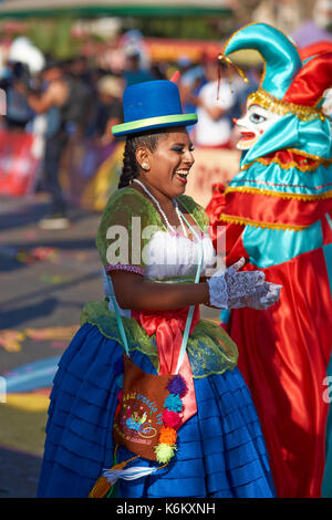 Pueblo dance group in ornate costume performing at the annual Carnaval Andino con la Fuerza del Sol in Arica, Chile. Stock Photo