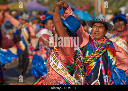 Pueblo dance group in ornate costume performing at the annual Carnaval Andino con la Fuerza del Sol in Arica, Chile. Stock Photo