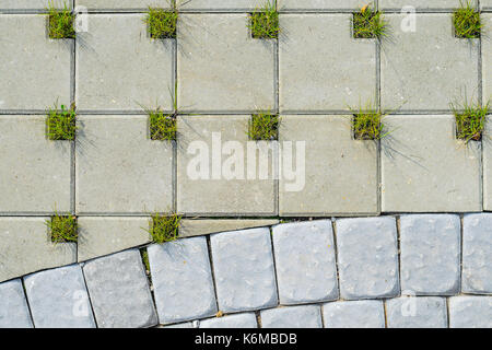 Square Grey Concrete Cobblestones with Holes for Grass Top View. Grey Cobblestone Texture. Landscaping Element Background Concept Stock Photo