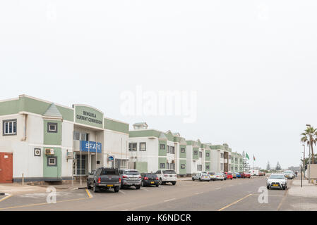 SWAKOPMUND, NAMIBIA - JUNE 30, 2017: A street scene with office buildings and vehicles in Swakopmund in the Namib Desert of Namibia Stock Photo