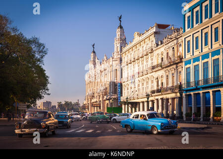 Central Square (Parque Central) with Inglaterra Hotel and The Great Theater of Havana on the left, Havana, Cuba. 1950s cars drive through the street. Stock Photo