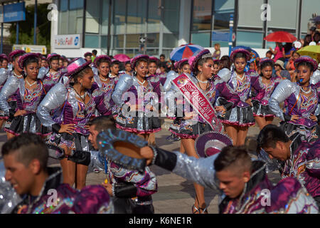 Caporales dancers in ornate costumes performing at the annual Carnaval Andino con la Fuerza del Sol in Arica, Chile. Stock Photo