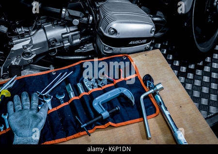 CHONBURI, THAILAND- SEPTEMBER 10, 2017 :Tool set on the table with black and white scene single cylinder head cover in BMW motorcycle shop Stock Photo