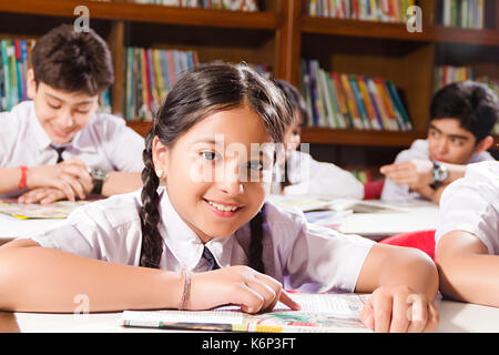 1 Indian School Girl Student Reading Book Study Education In Library ...