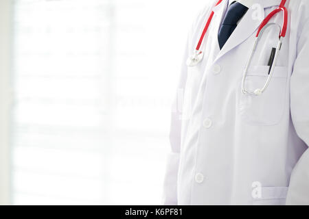 Unknown doctor posing in the office, he is wearing a stethoscope . Stock Photo
