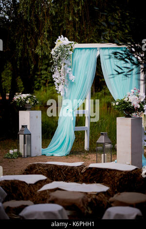 Color Lake Arch Wedding Arch of turquoise color on background lake Stock Photo - Alamy