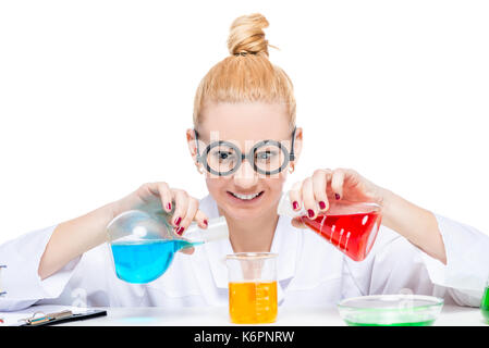 funny laboratory assistant chemist mixes fluids in test tubes Stock Photo