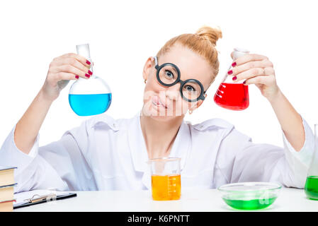 Cheerful and nuts lab assistant with red and blue liquid in flasks on white background Stock Photo