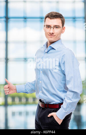 Male successful young businessman posing in office Stock Photo