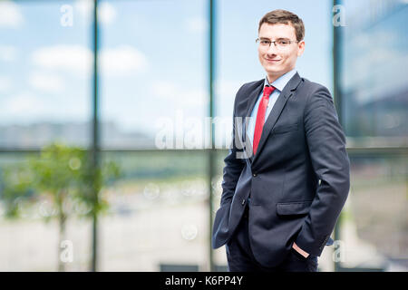 Successful businessman posing in office Stock Photo