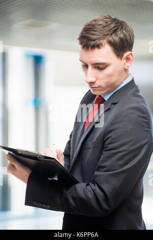Vertical portrait of a director with important documents Stock Photo