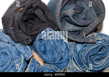 roll denim jeans stack on white background Stock Photo