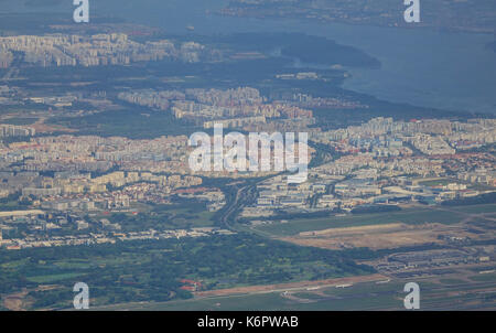 Aerial Singapore city view with crossroads and roads, houses, buildings, parks. Stock Photo