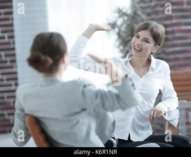 members of the business team giving each other a high five. Stock Photo